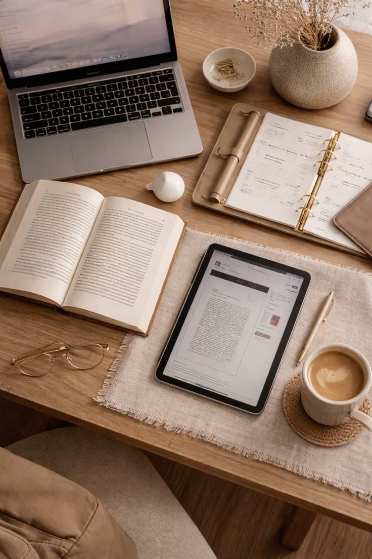 Soft daylight resting across a tidy desk with a notebook and a cup